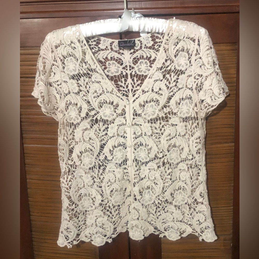 Lacey embroidered top. Can be dressy or casual with jeans.,